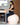 woman sat at table on birthing ball and stability ring
