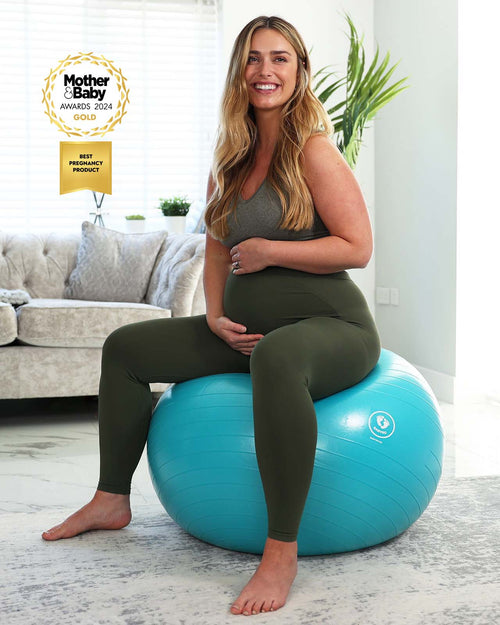 pregnant woman sat on birthing ball