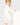 baby wearing white baby grow