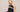 Pregnant woman sitting in the BABYGO® Maternity Bra and over the bump leggings