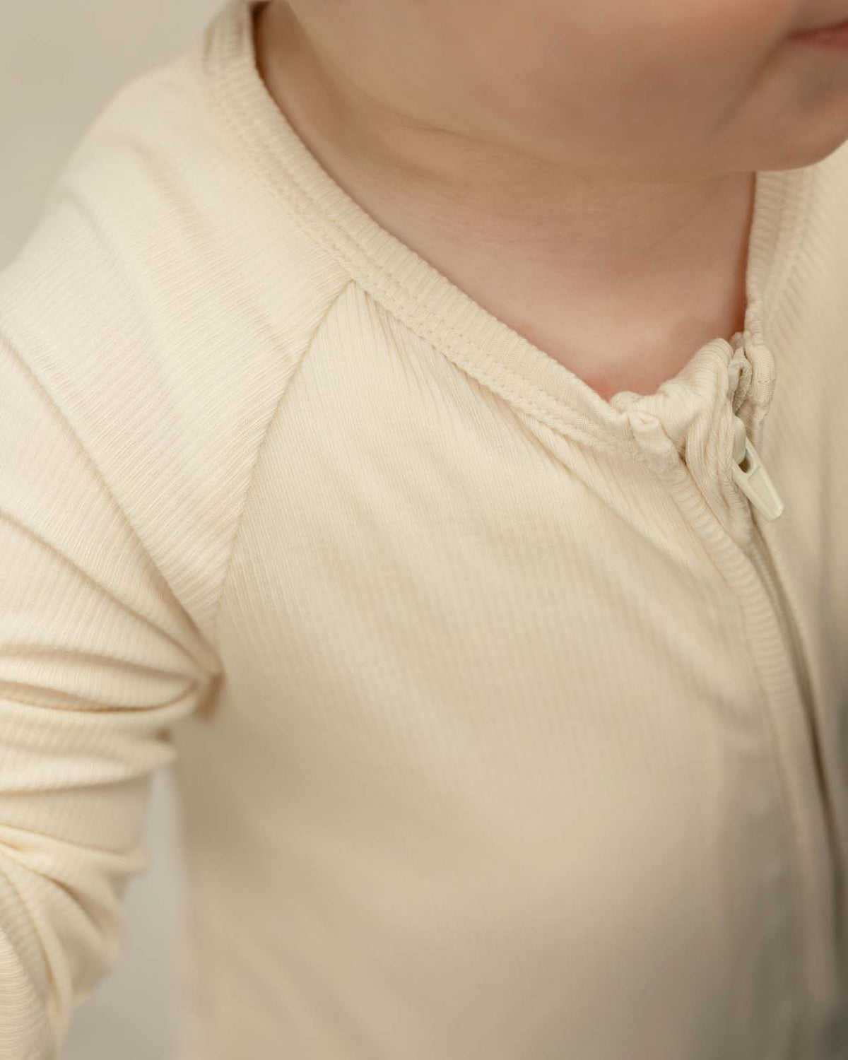 BABYGO® Ivory Ribbed Zip Sleepsuit