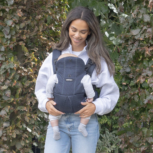 Mum with a newborn in the black AirMesh carrier