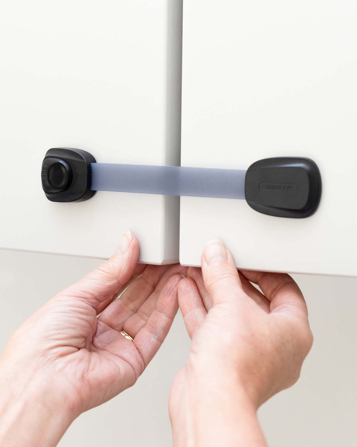child safety strap on cupboard
