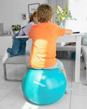 child on sensory exercise ball