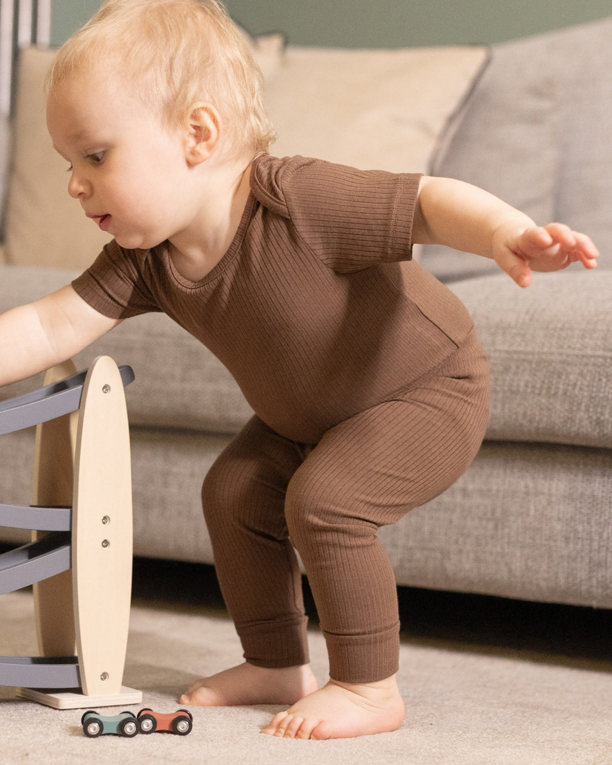 Baby sitting in mocha ribbed leggings