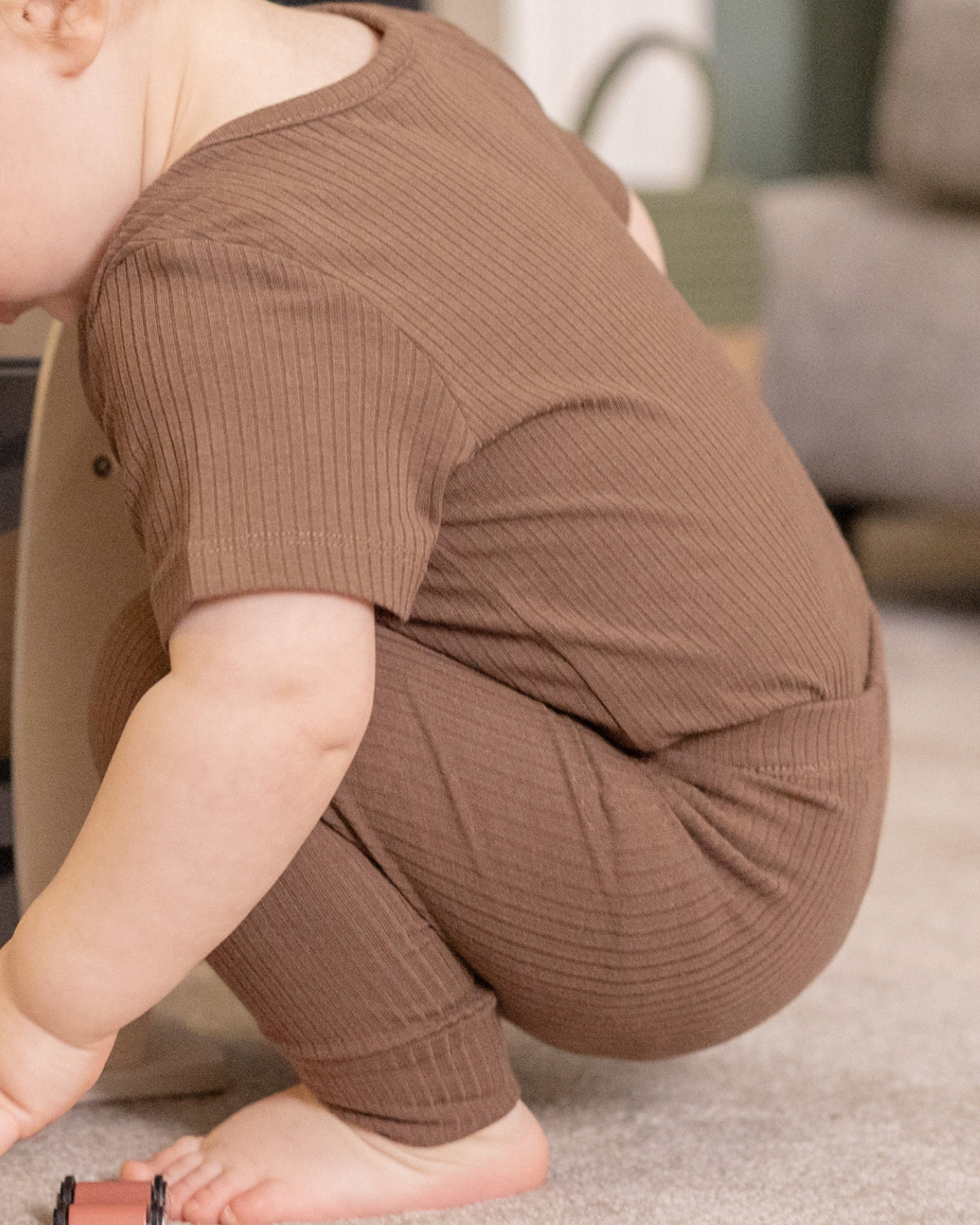 Baby wearing a mocha ribbed short sleeve bodysuit and leggings set, view 6