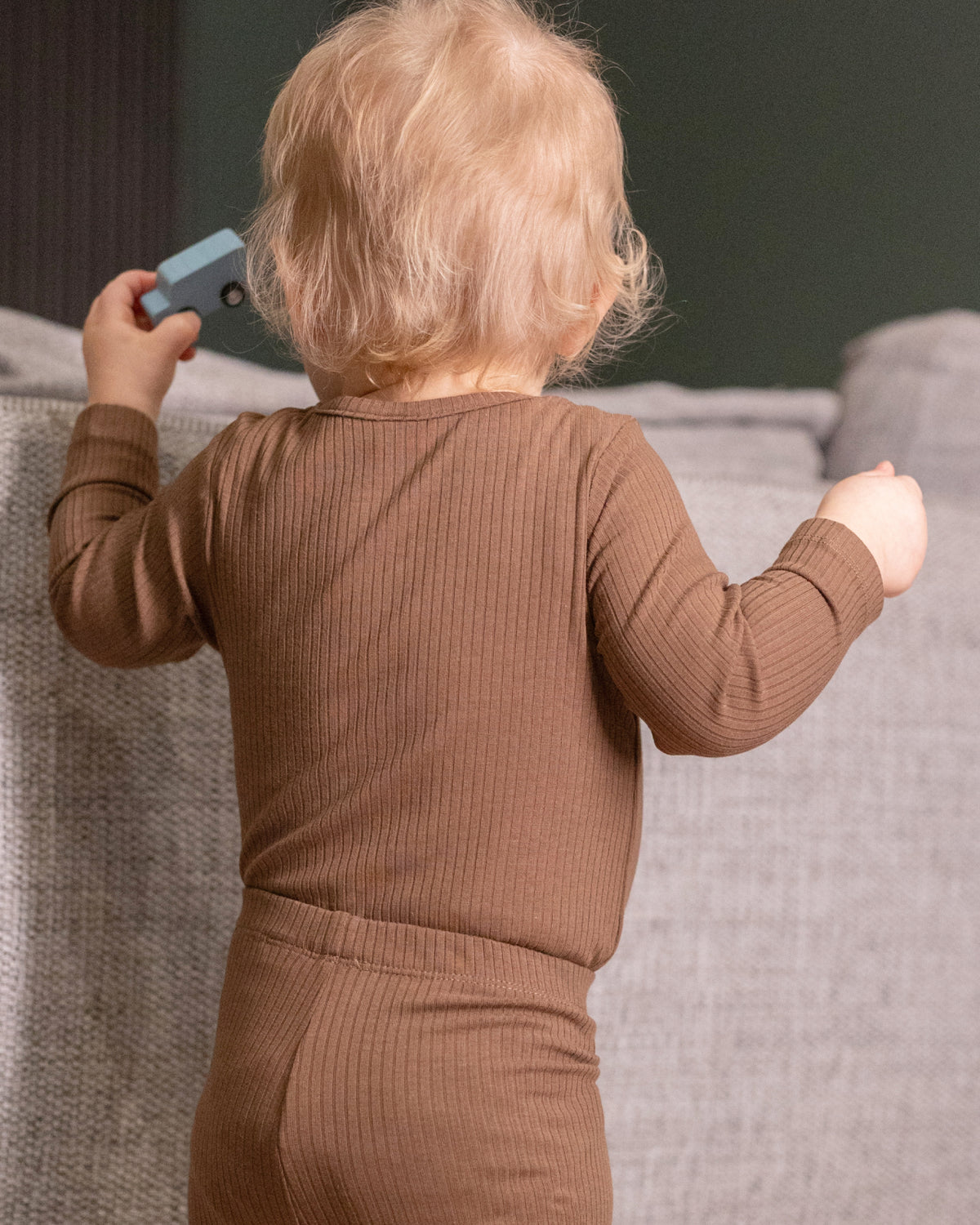 Baby wearing long sleeve baby bodysuits, 2 pack in mocha and oatmeal, view 7