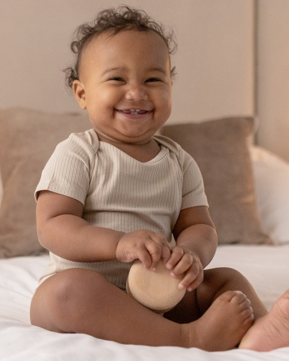 Baby wearing short sleeve baby bodysuits, 2 pack in mocha and oatmeal, view 2