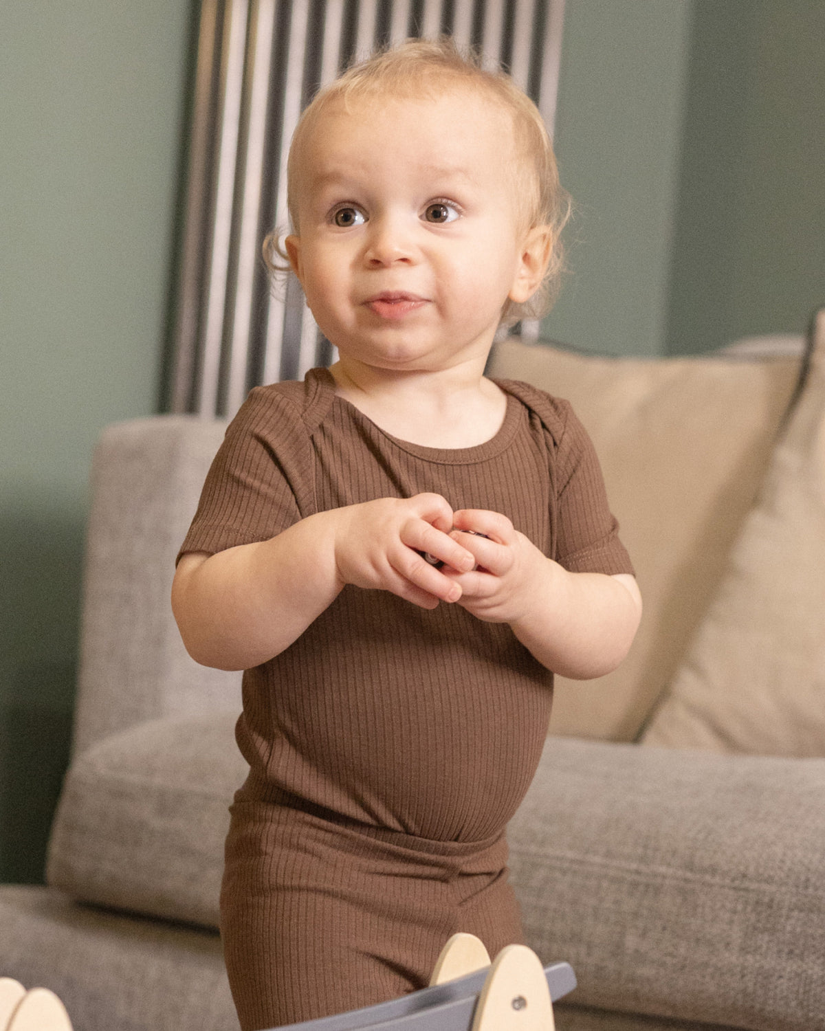 Baby wearing short sleeve baby bodysuits, 2 pack in mocha and oatmeal, view 5
