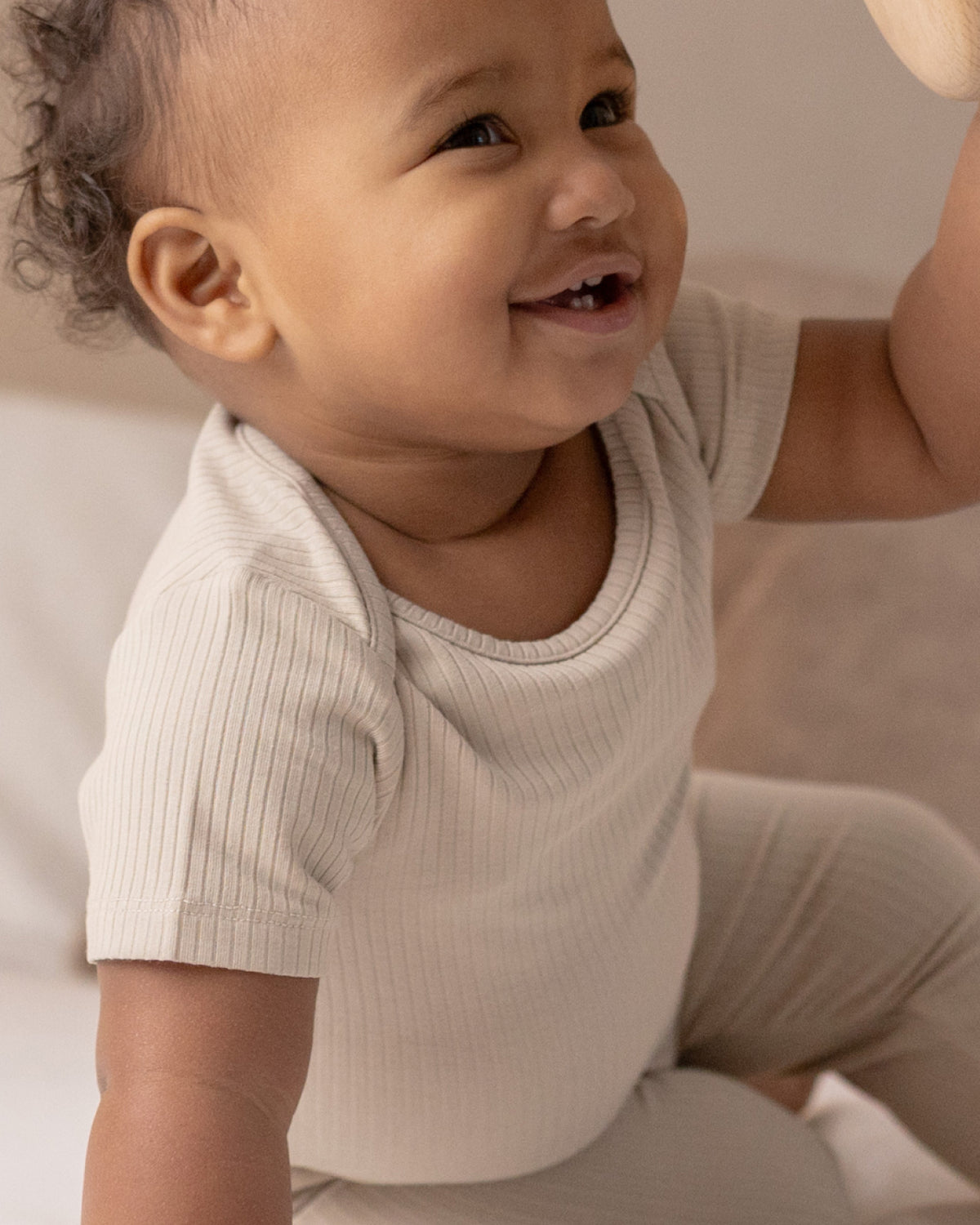 Baby wearing short sleeve baby bodysuits, 2 pack in mocha and oatmeal, view 6