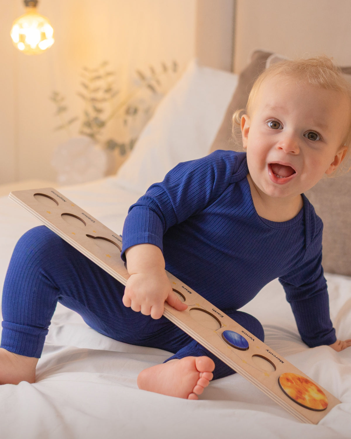Baby wearing a navy ribbed long sleeve bodysuit and leggings set, view 2