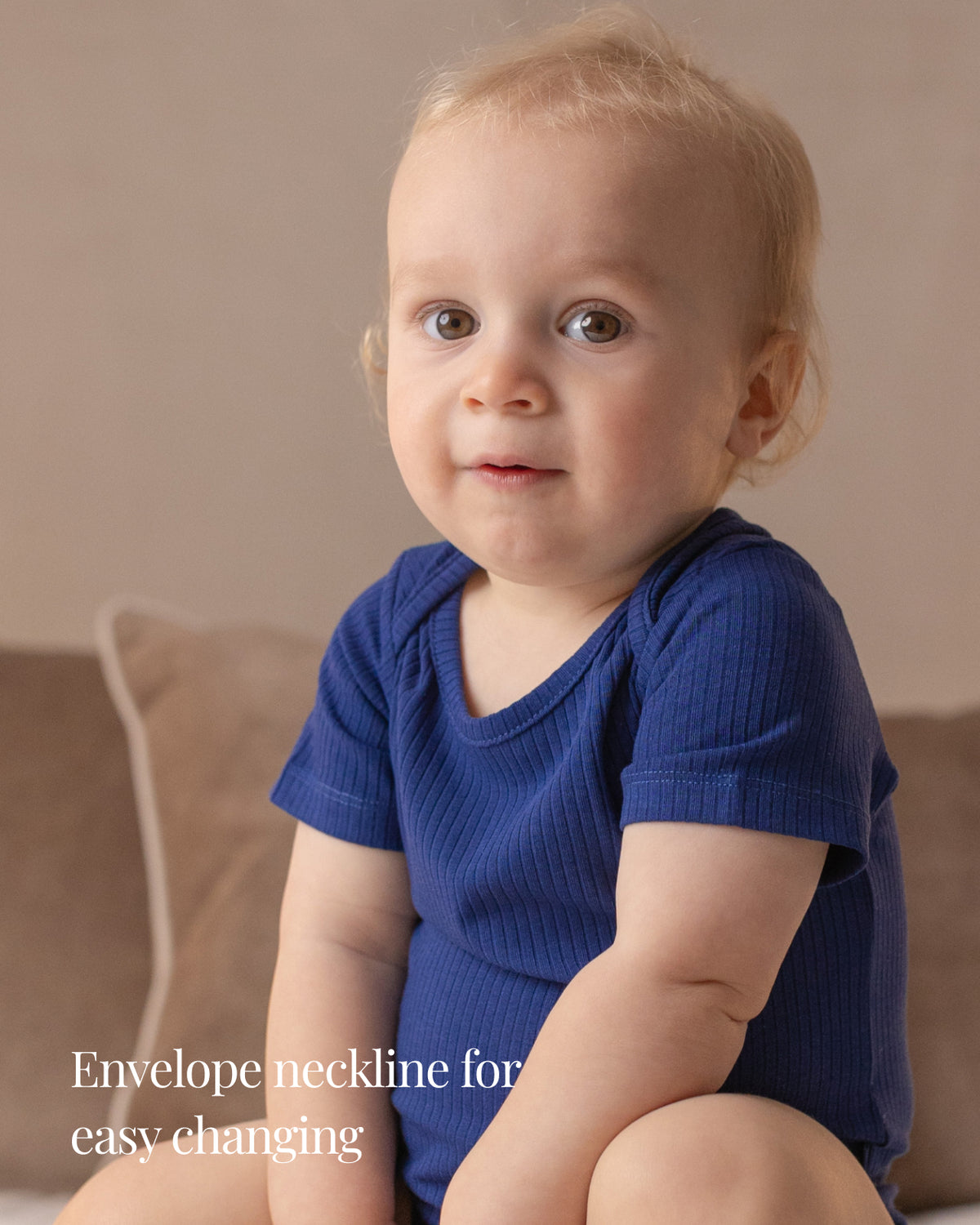 Baby wearing a navy ribbed short sleeve bodysuit and leggings set, view 3