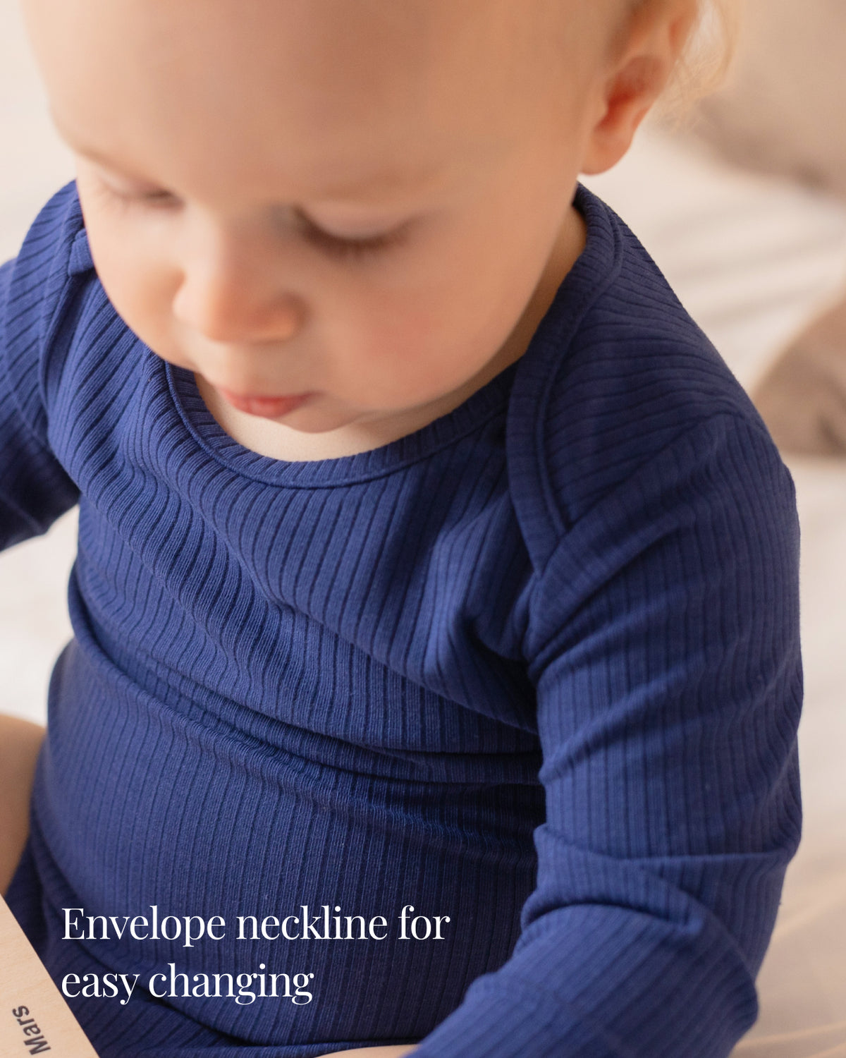 Baby wearing a navy ribbed long sleeve bodysuit and leggings set, view 3
