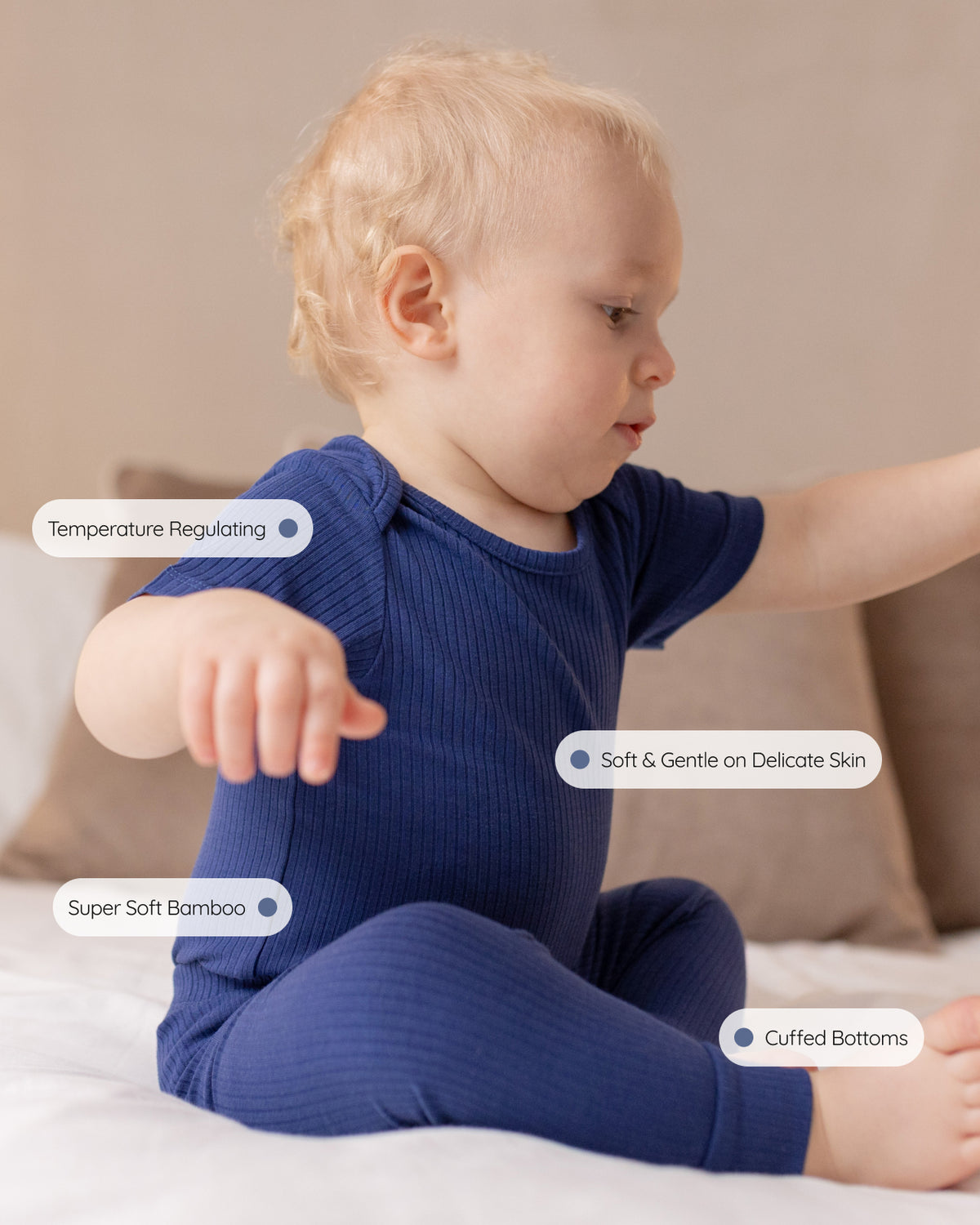 Baby wearing a navy ribbed short sleeve bodysuit and leggings set, view 4