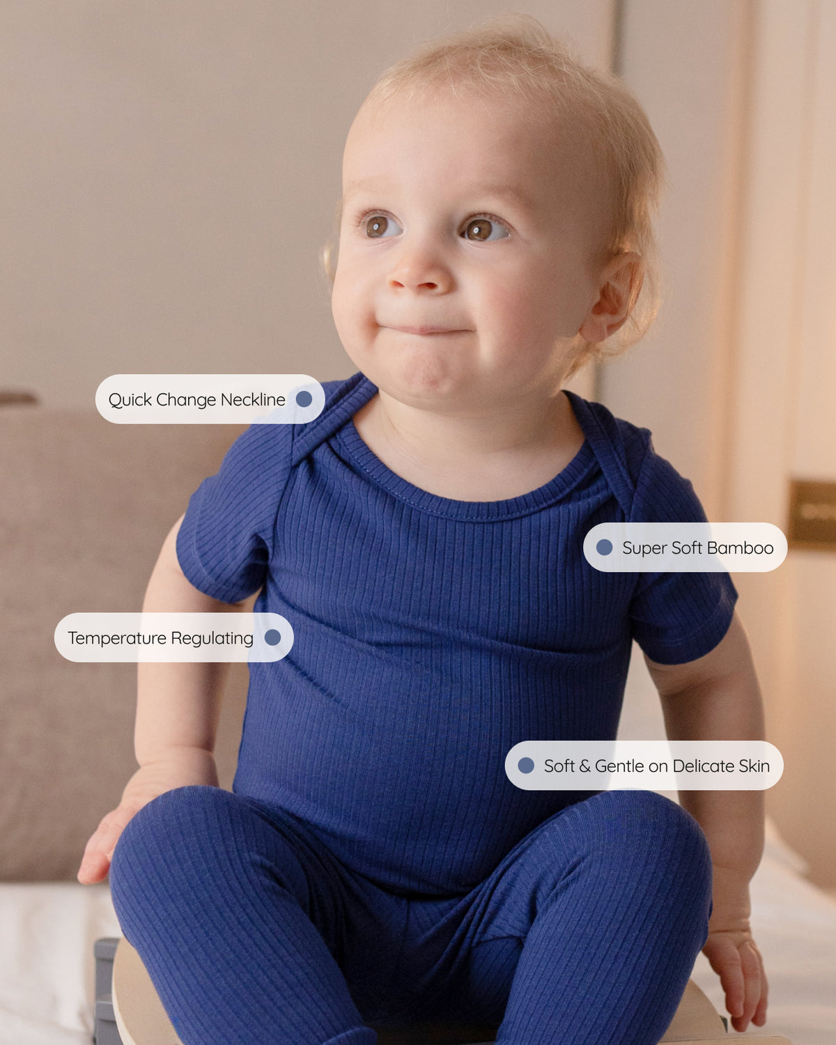 Navy ribbed bamboo short sleeve bodysuit, features