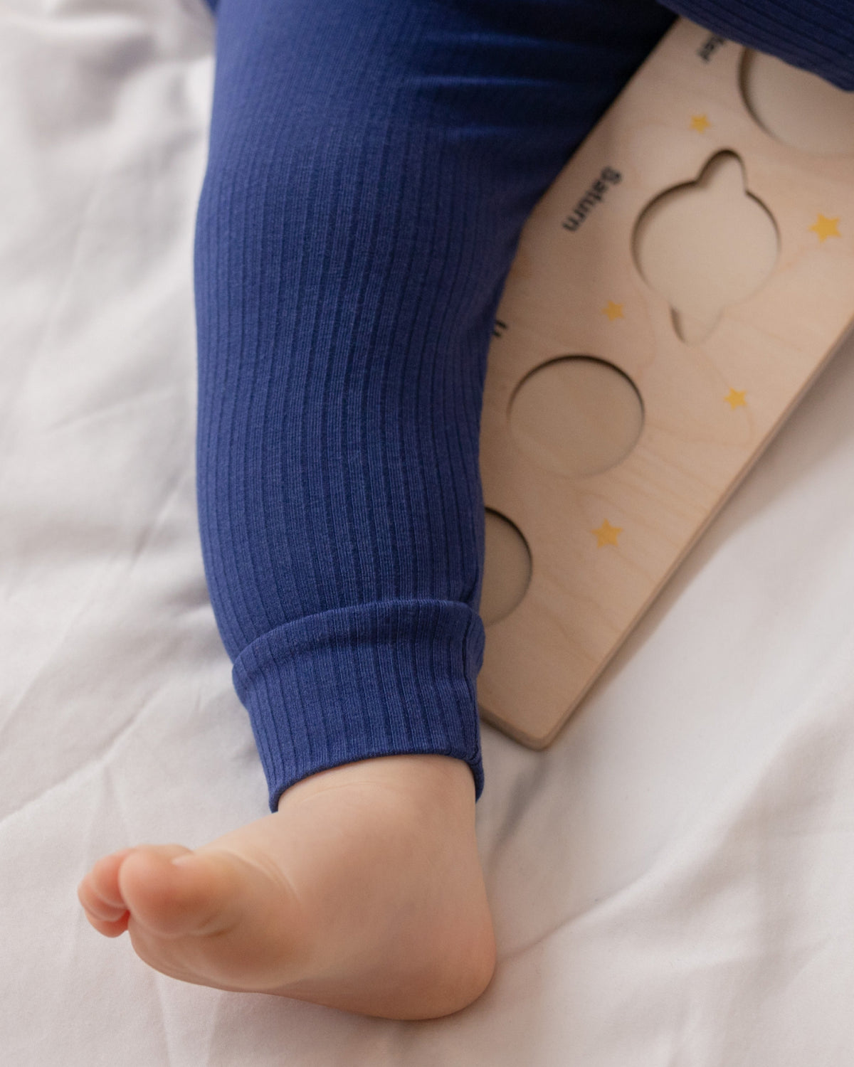 Baby wearing a navy ribbed short sleeve bodysuit and leggings set, view 5