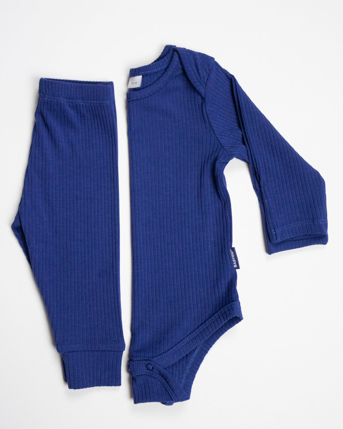 Baby wearing a navy ribbed long sleeve bodysuit and leggings set, view 7