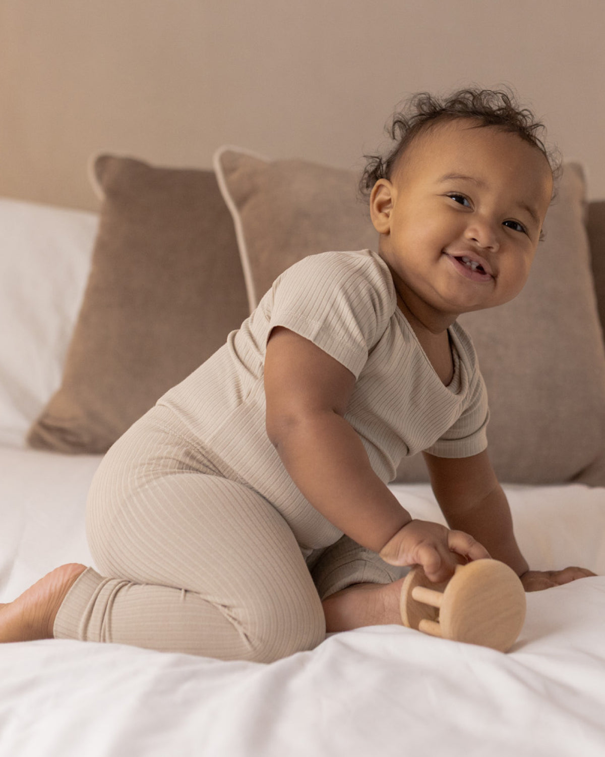 Baby wearing a oatmeal ribbed short sleeve bodysuit and leggings set, view 2