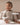 Baby wearing a oatmeal ribbed long sleeve bodysuit and leggings set, view 4
