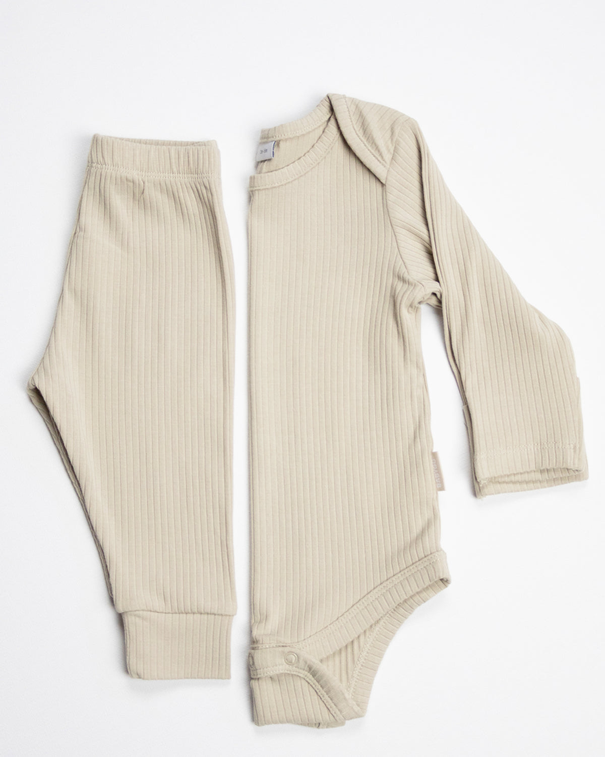 Baby wearing a oatmeal ribbed long sleeve bodysuit and leggings set, view 7