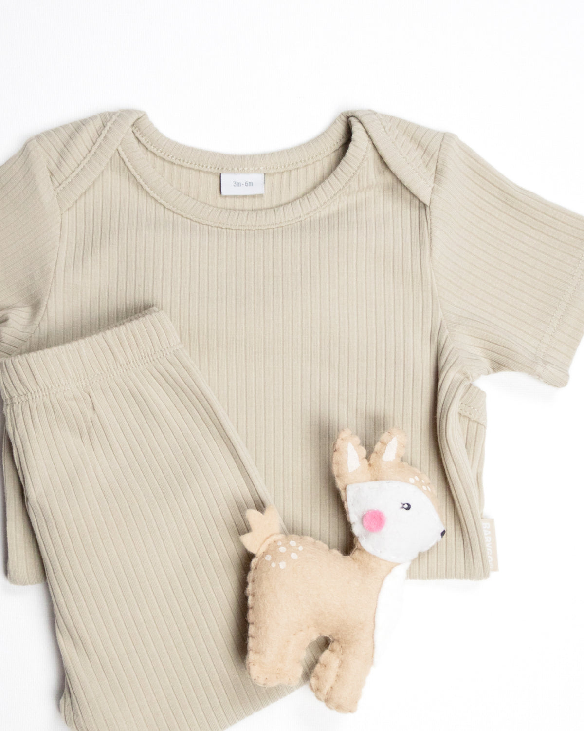 Baby wearing a oatmeal ribbed short sleeve bodysuit and leggings set, view 7
