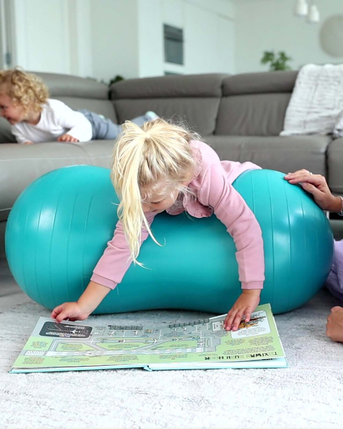 child on blue peanut ball