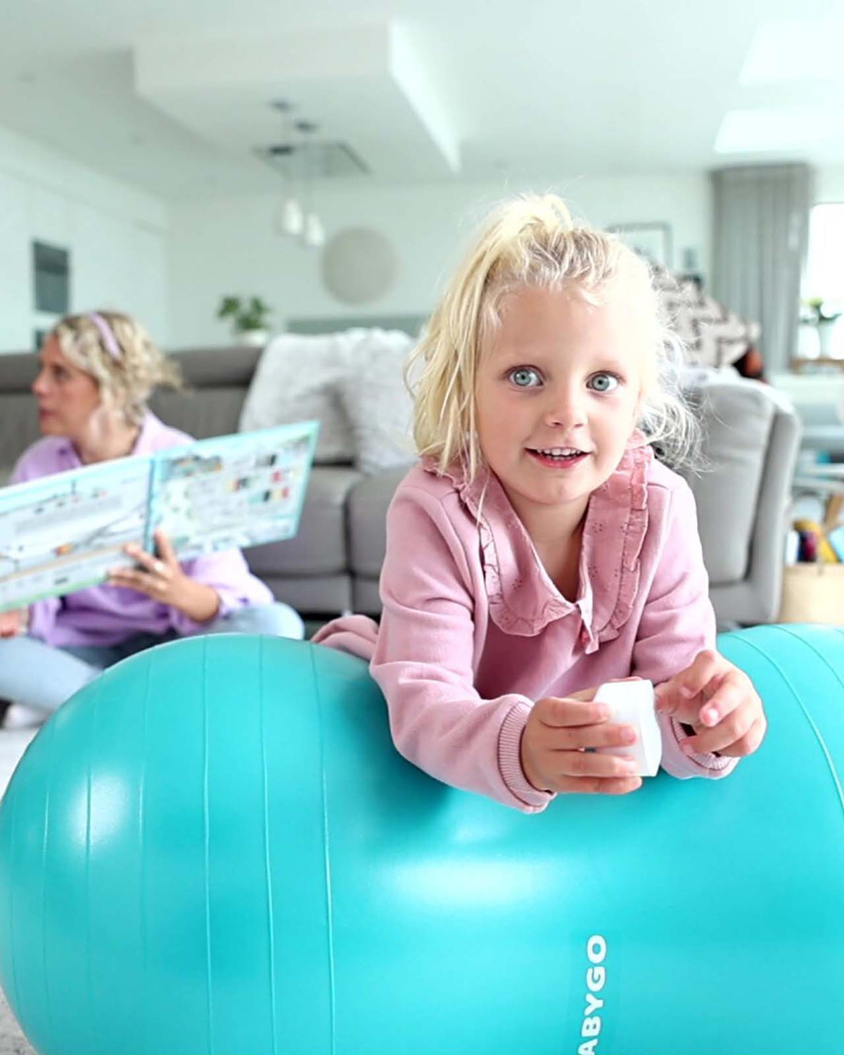  child on blue peanut ball