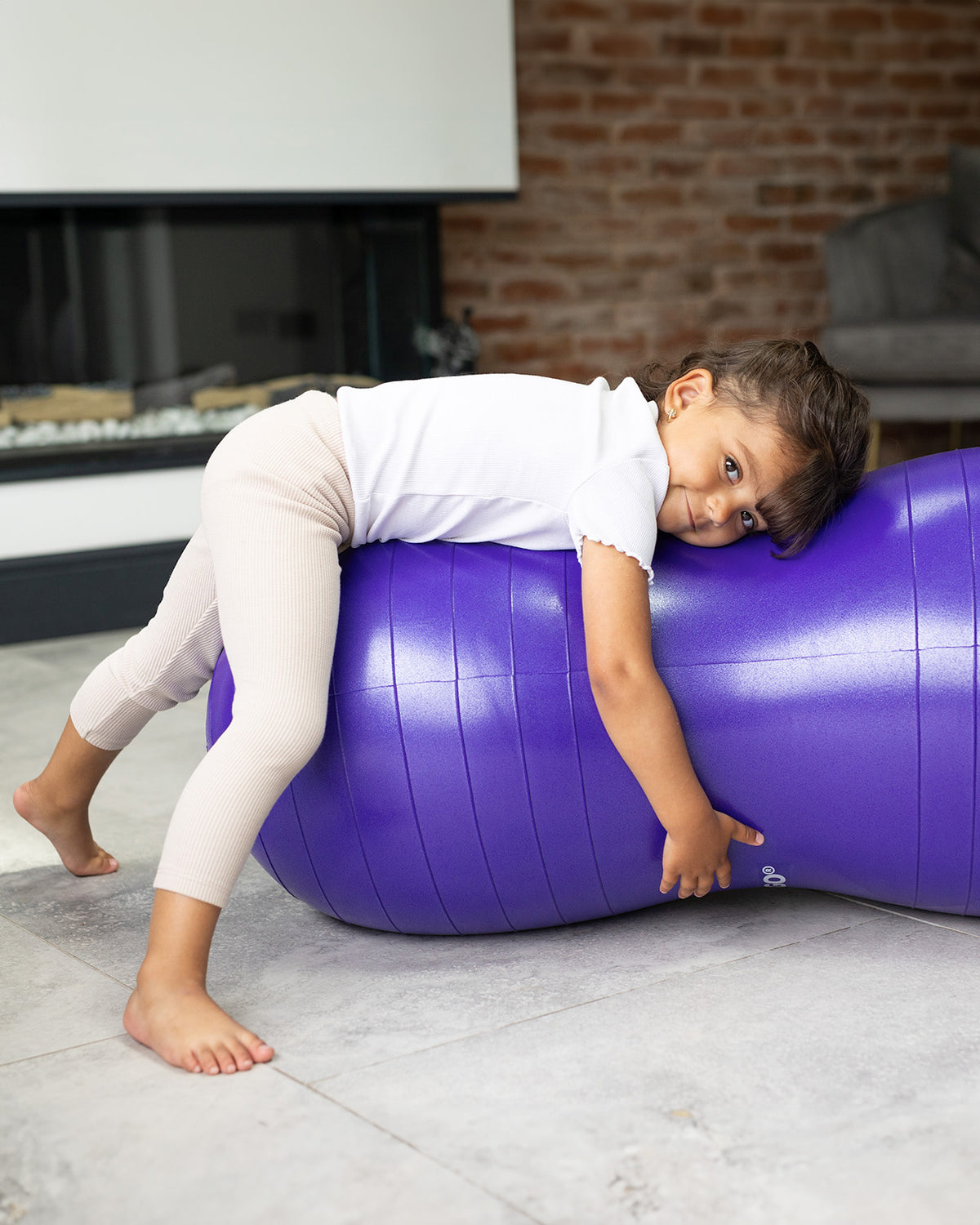 child on peanut sensory ball