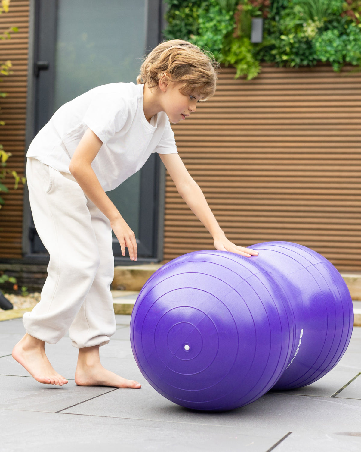 child playing with peanut sensory ball