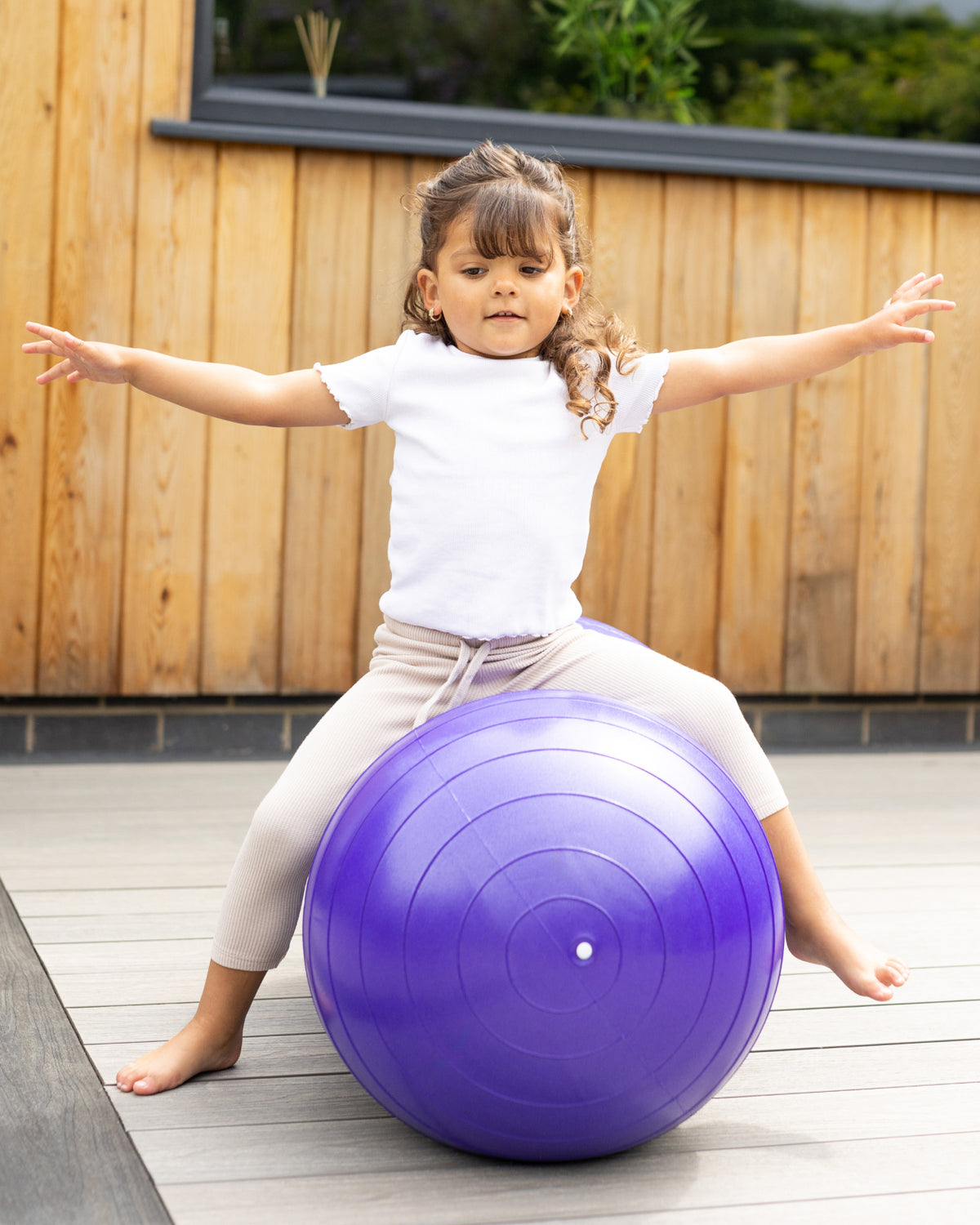 child on peanut sensory ball