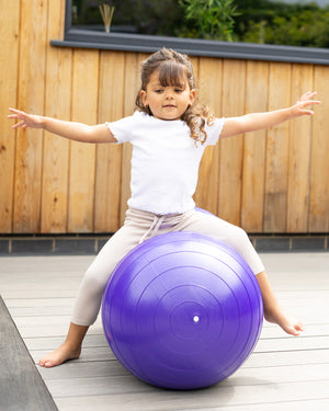 child on peanut sensory ball