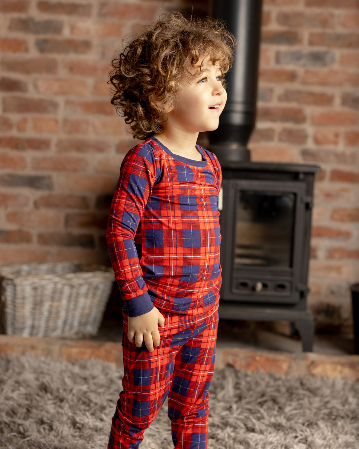 child in tartan pjs