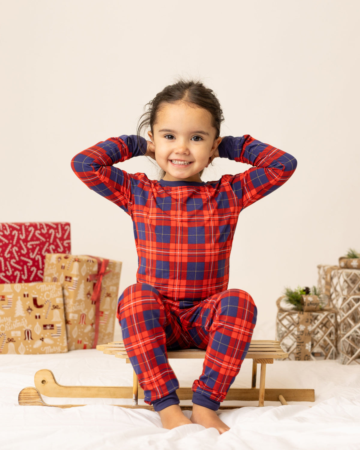 child in tartan pjs