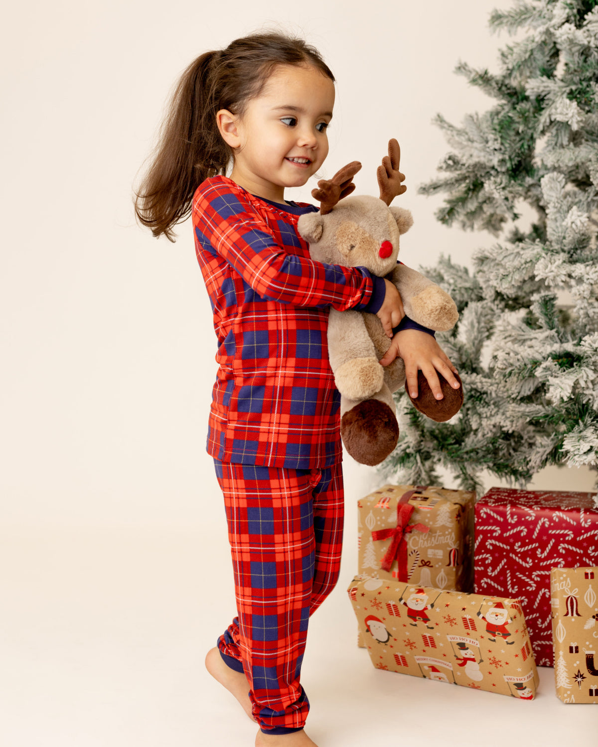 child in tartan pjs