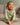 Baby sitting in a sage ribbed long sleeve bodysuit