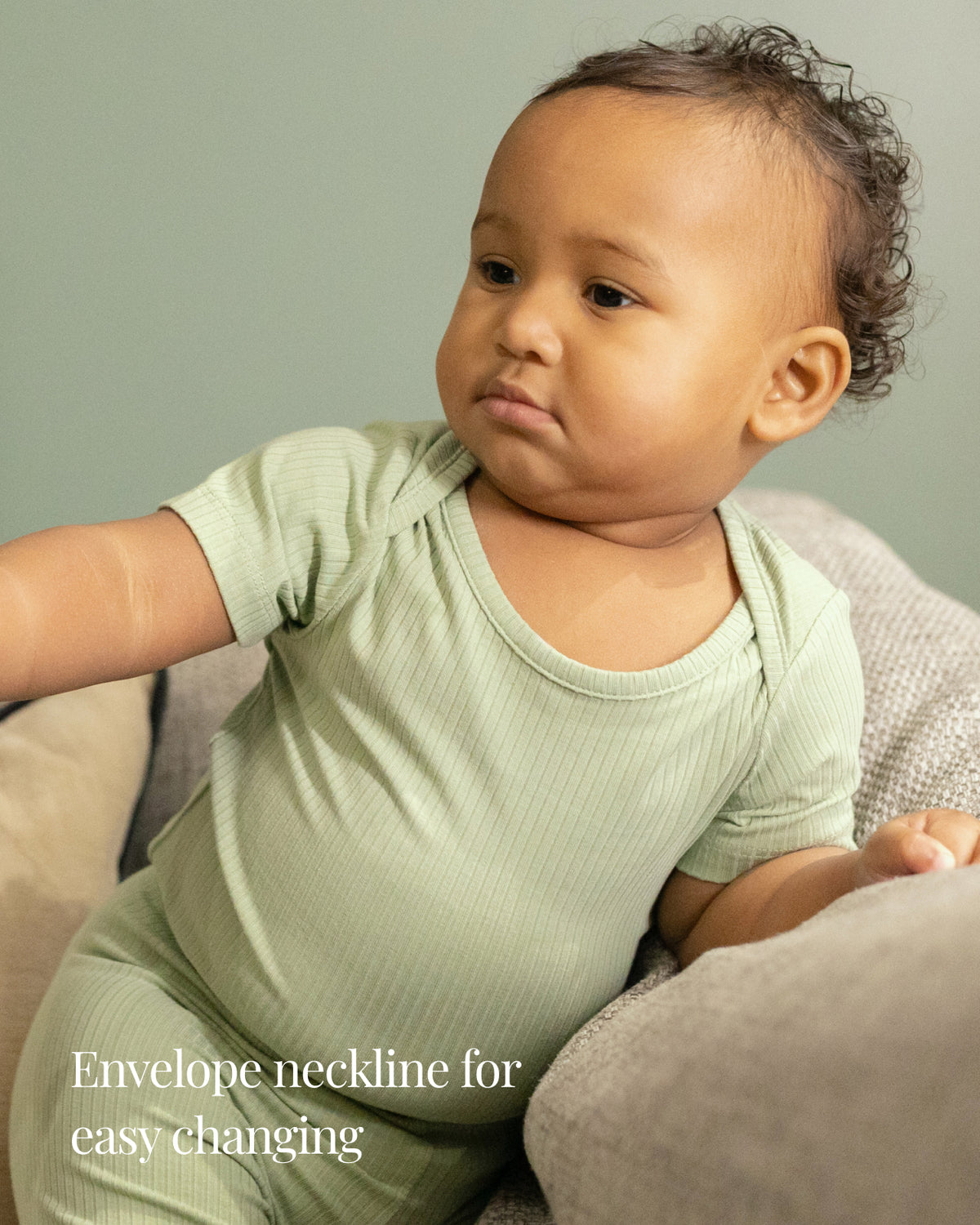 Baby wearing a sage ribbed short sleeve bodysuit and leggings set, view 3