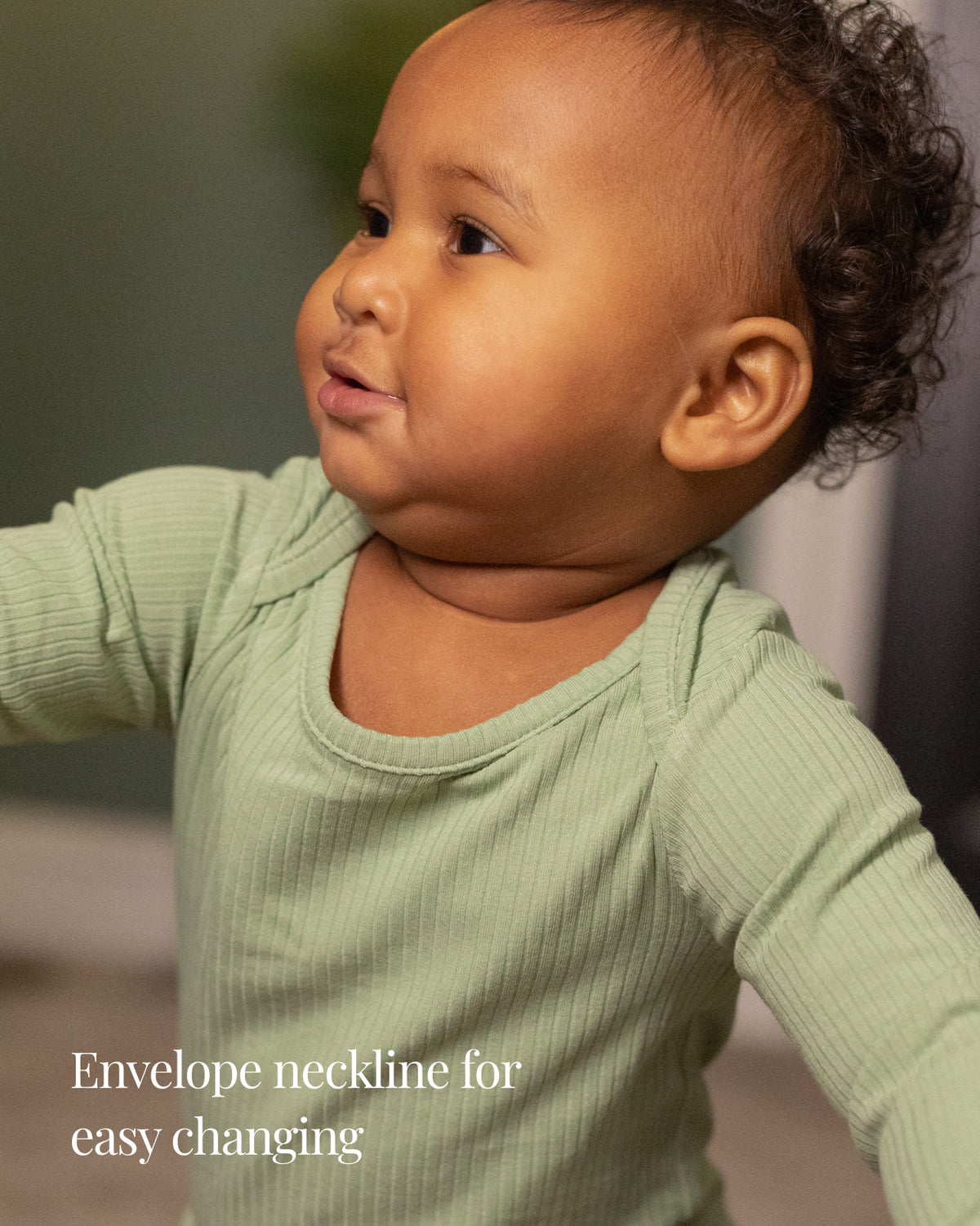 Baby wearing a sage ribbed long sleeve bodysuit and leggings set, view 3