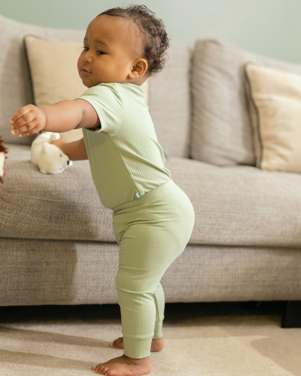 Baby wearing a sage ribbed short sleeve bodysuit and leggings set, view 5