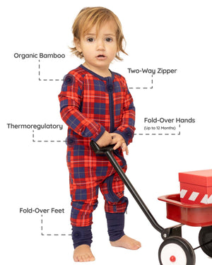 baby wearing tartan baby grow