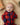baby wearing tartan baby grow