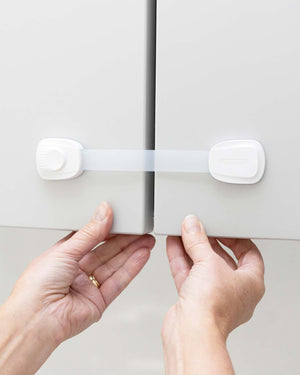 child safety straps on cupboard